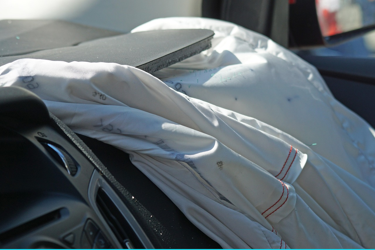 Airbag deployed in vehicle interior, highlighting safety features following a collision, relevant to uninsured motorist claims.